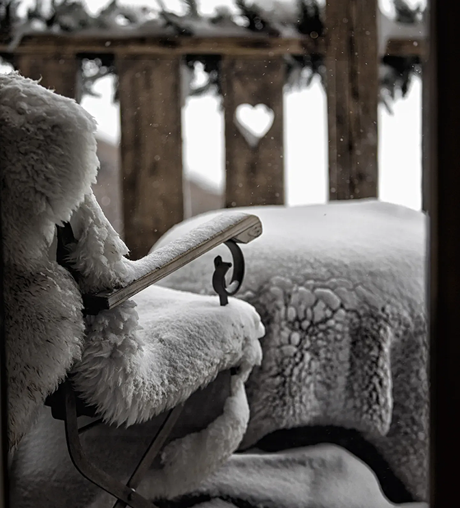 A cosy chair on an Alpine balcony